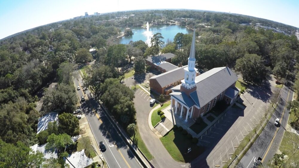 Aerial view of church and lake